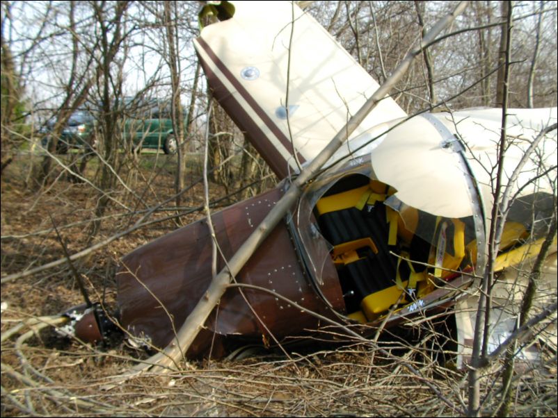 Left wing folded under, canopy smashed, but the aircraft protected me from harm and I walked away.  Not my best landing, but they say any landing you walk away from is a good landing.  Look at my poor baby though, I think she is beyond hope.