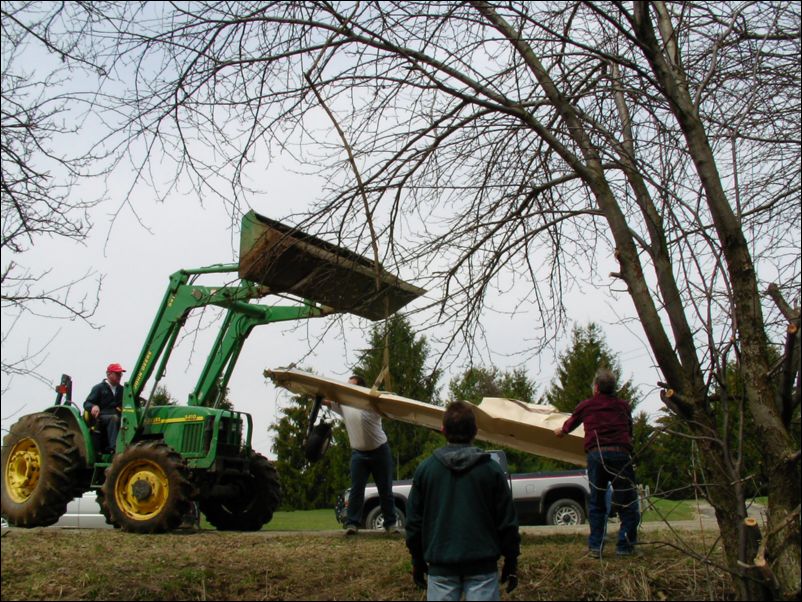 Right wing clear of woods, rain is on it's way, they had to work fast now to beat the storm.