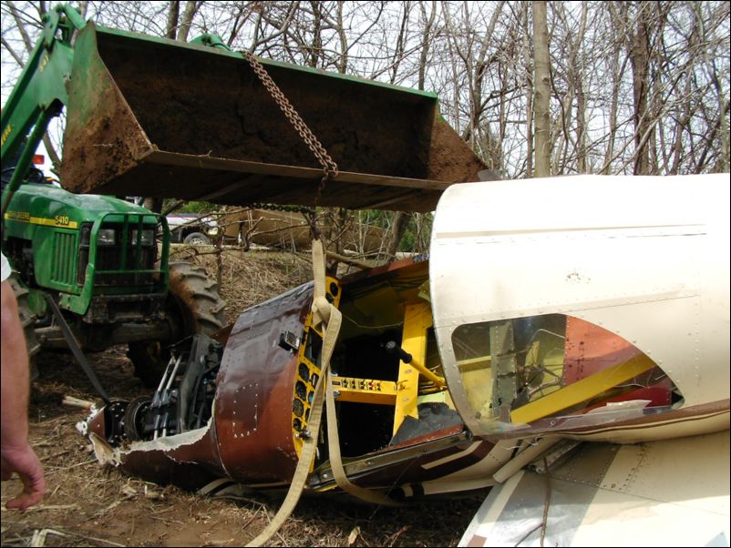 Put strap around fuselage and try to drag it out of the woods.