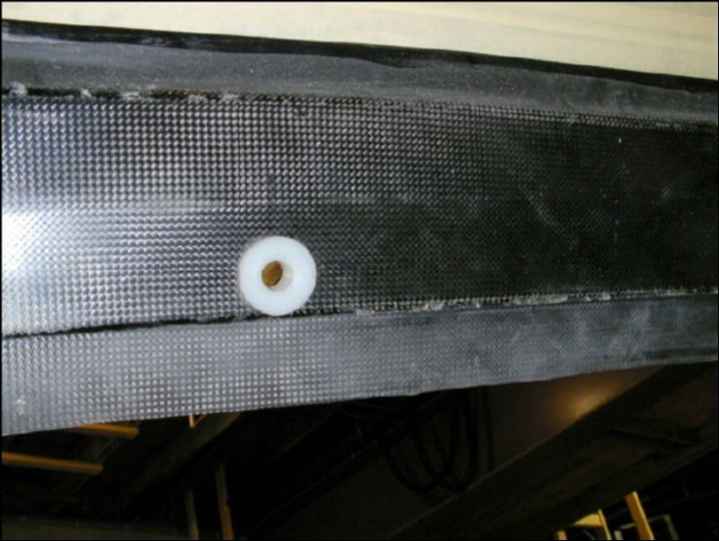 Drill hole in co-pilot door for latch bushing and insert bushing