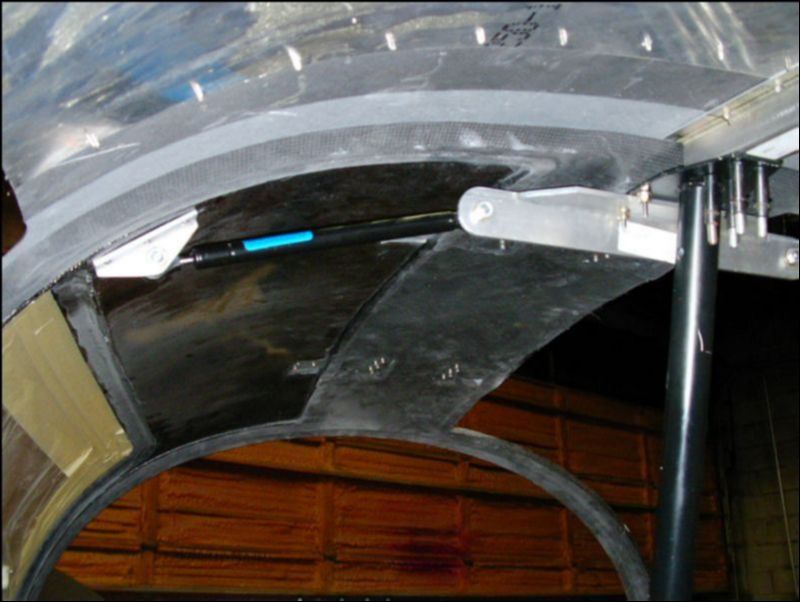 This shows the strut installed with the door closed as viewed from the rear seat.