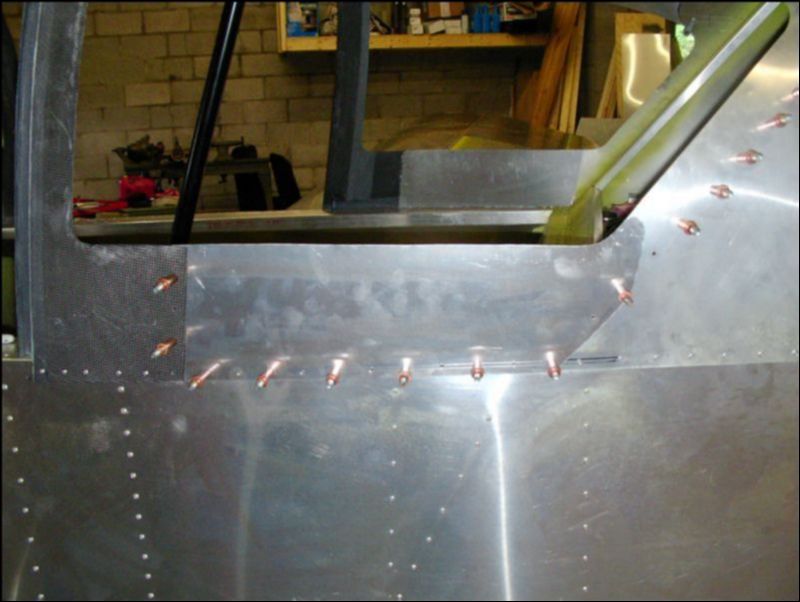 Cut, drill, and cleco the skin under the rear windows.