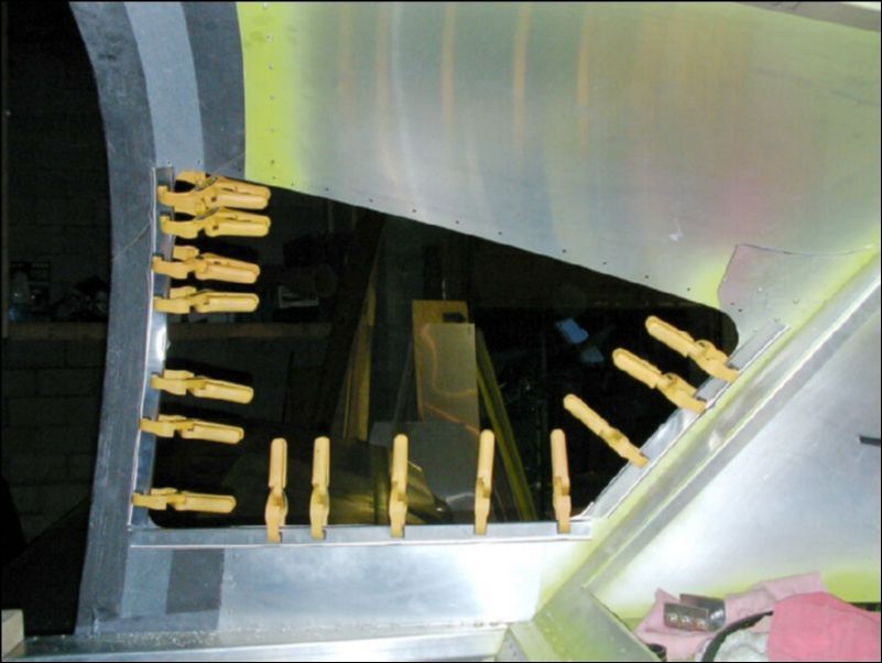 Clamp the upholstery channels in place and then drill the A4 holes from the outside.