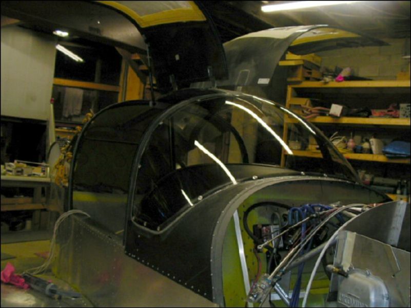 Glue and rivet windshield to the canopy.