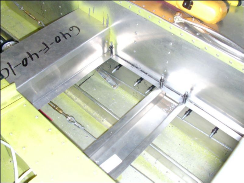 Cut, drill, and cleco the rear floor L's and channel.  Be sure to clear the control cables.  Which means NO LEG ROOM!  VERY POOR DESIGN!