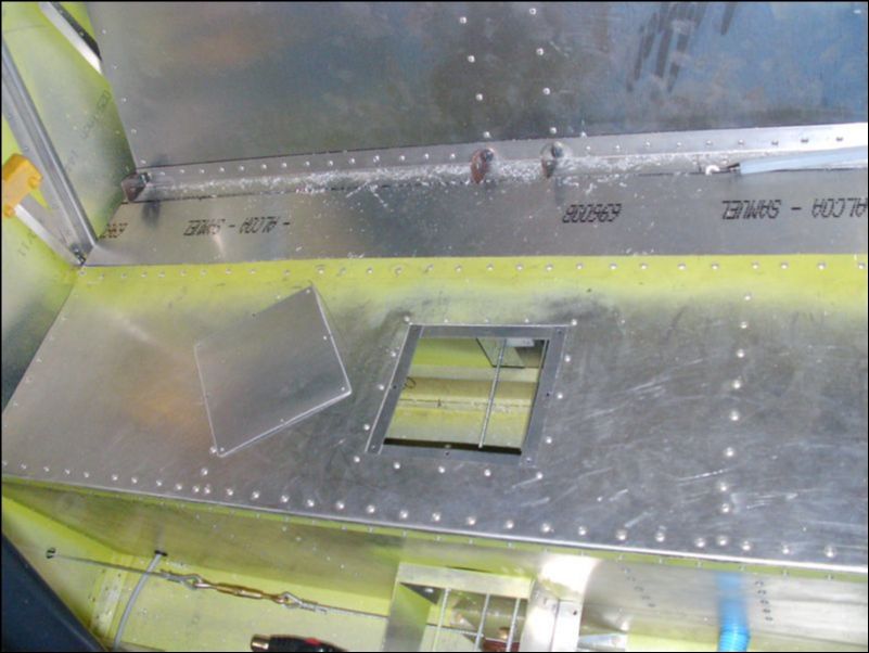 Cut access hole in middle of rear seat bottom.