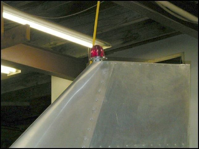 Cut hole in top of rudder and another small hole in the bottom front of the rudder.  Fished wire for beacon and mounted beacon to the top of the rudder.  This is not needed, but I like to have a beacon on any aircraft I fly.