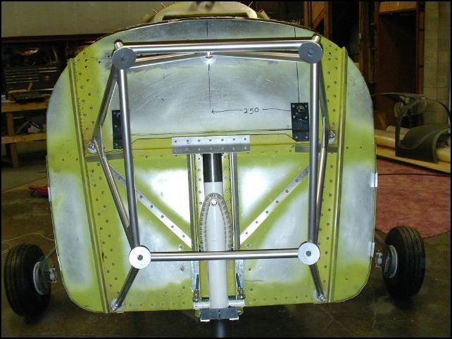 Bolted engine mount to firewall.