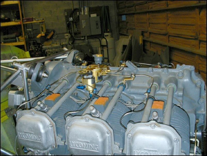 Moved the fuel divider back on the engine, installed fuel injection nozzles and tubes.