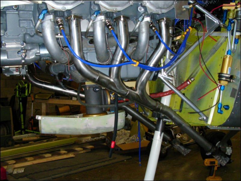 Bolt exhaust pipes to engine