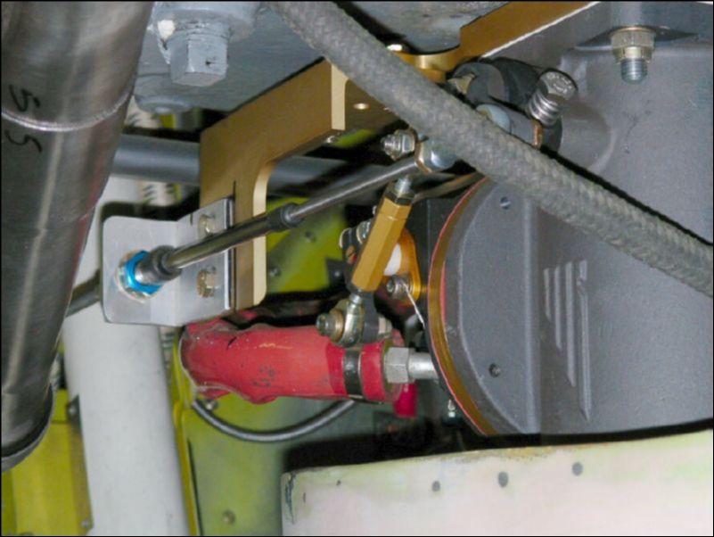 Connect the throttle cable linkage.