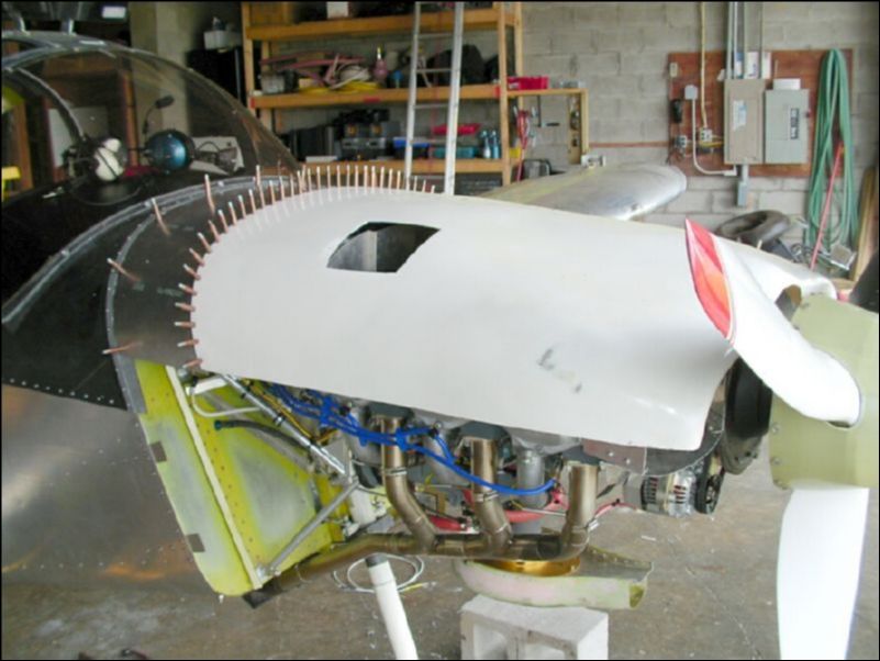 Postion top cowling, drill and cleco it to the top cowling extension.