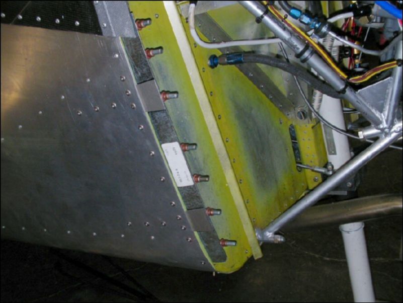 Drill and cleco the bottom cowling attachment L to the firewall.