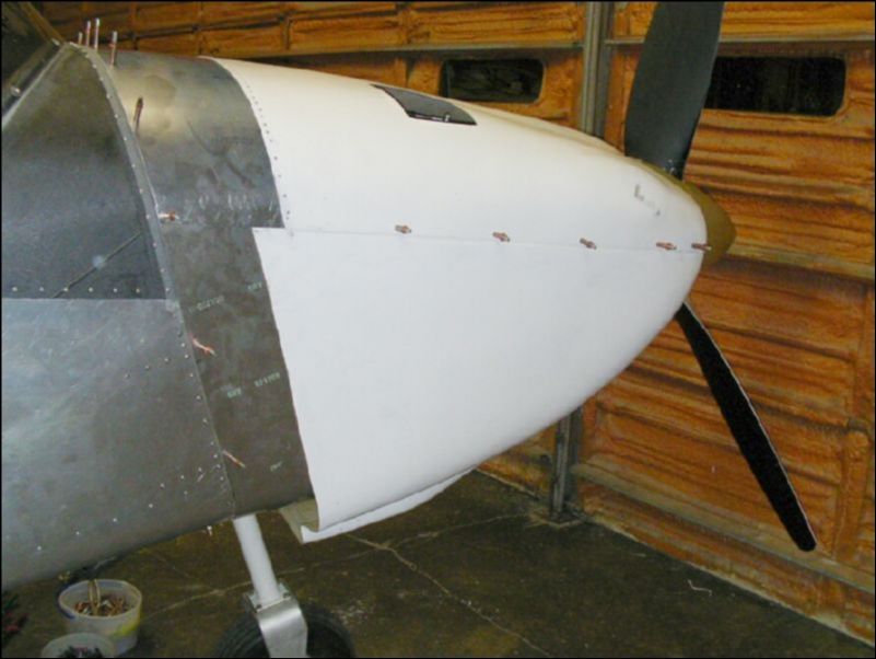 Re-install the bottom cowling.  Notice that we are going to have to cut the bottom out of the bottom cowling and do some glass work to make it fit correctly.