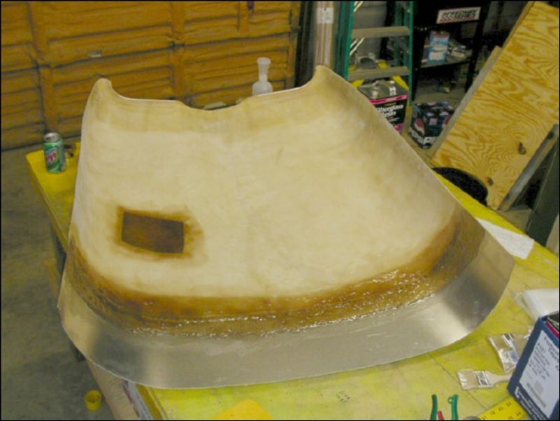 Use fiberglass matting and resin to fill in the oil access hole since it is on the wrong side of the cowling.  Also glass over the seam where the extension joins the original cowling.