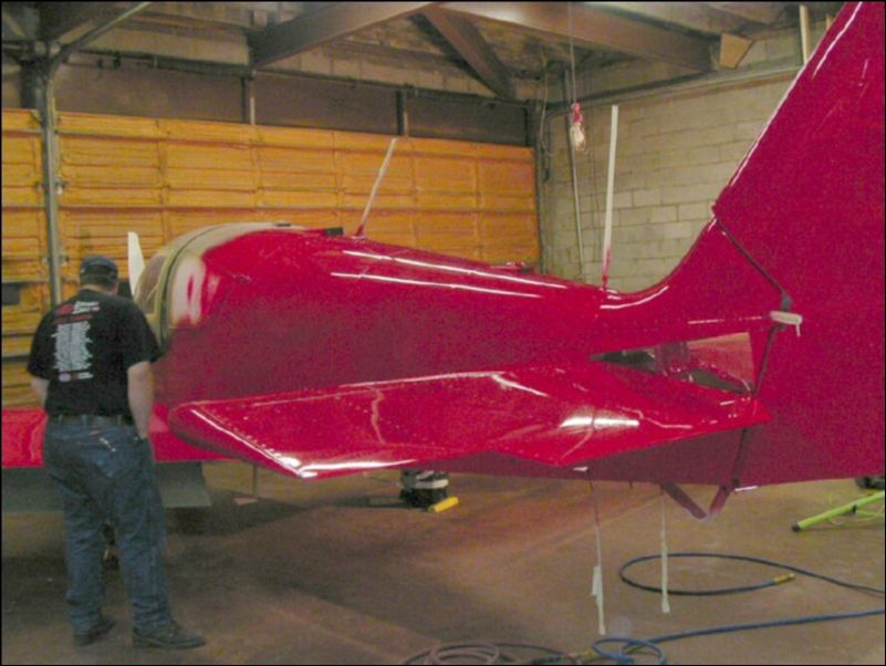 Adam is inpecting his work and getting ready to go home for some well earned rest.  Tomorrow he will be back to tape off the aircraft and spray the next color!