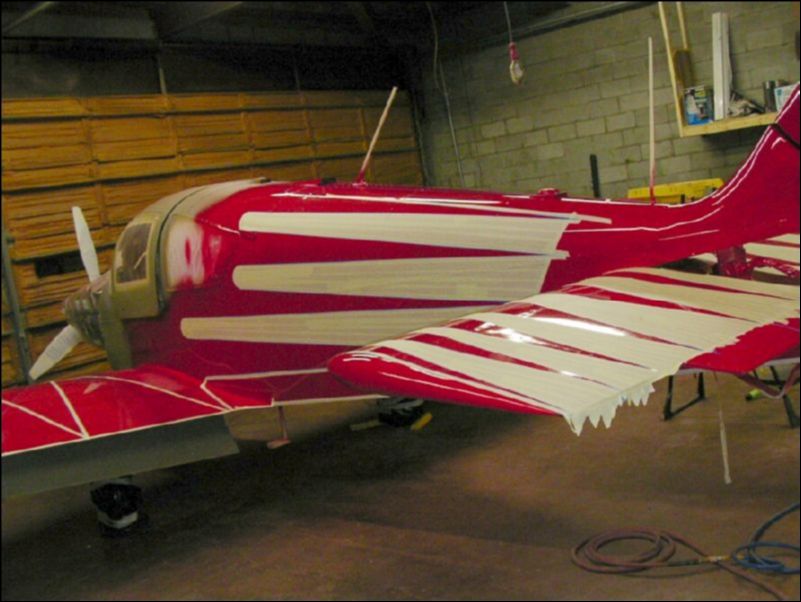 Tape off red area of aircraft to prepare for the next color.