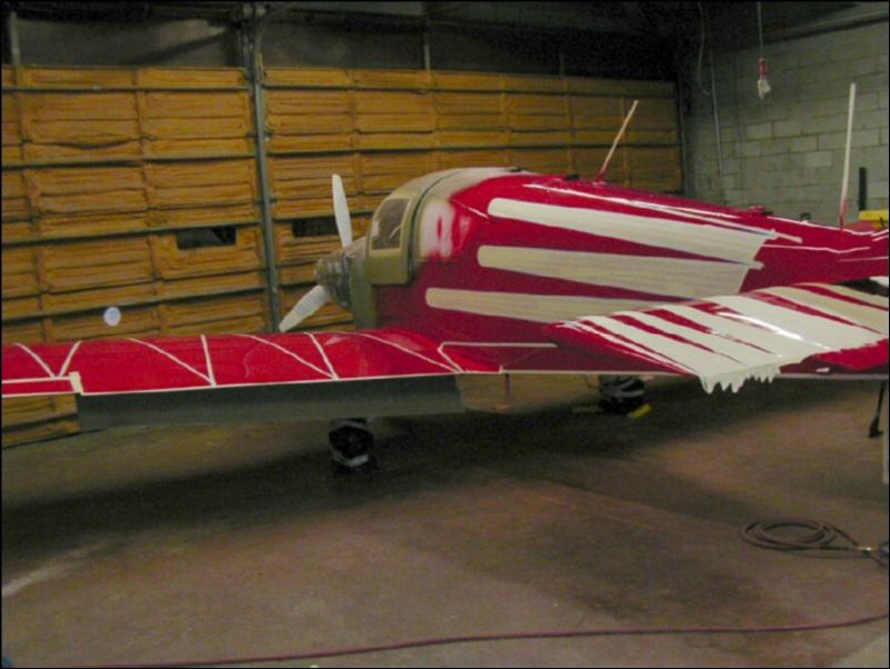 Tape off red area of aircraft to prepare for the next color.