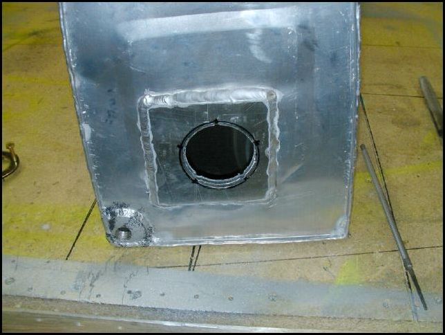 Drill hole in side of fuel tank for fuel sender.