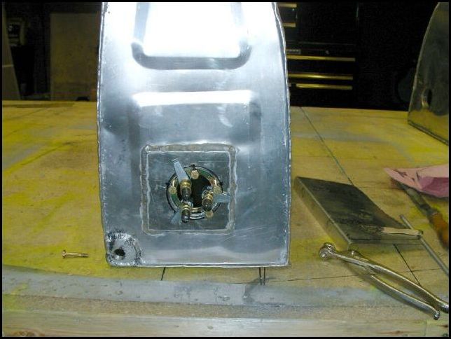 Not sure how you are supposed to do this but I used a fuel proof gasket adhesive to attach the fuel sender mounting ring to the inside of the tank.  