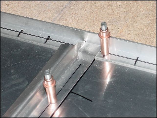 Position the Z angles on the bottom skin, drill and cleco to table.  All Z angles are P40 to P48.  The Z angles around the access door that are in the tip to tail position are not joggled.