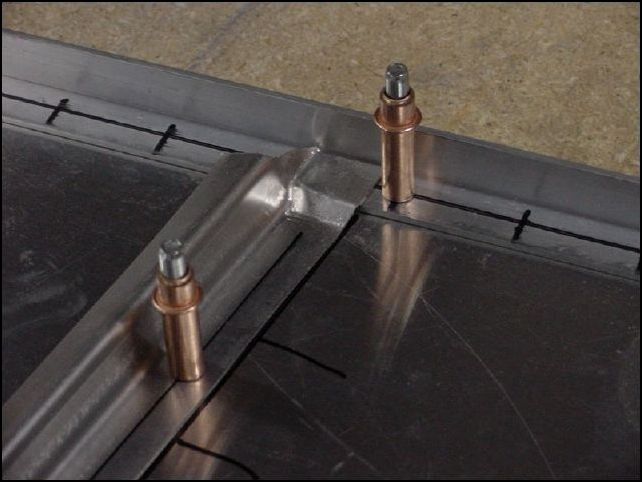 Position the Z angles on the bottom skin, drill and cleco to table.  All Z angles are P40 to P48.  The Z angles around the access door that are in the tip to tail position are not joggled.