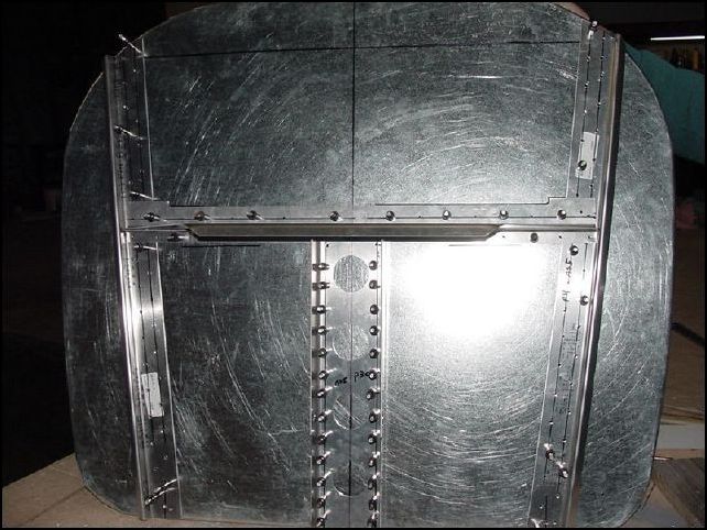 Draw center line on flange of 20-F-16-1 (upper horizontal Z).  Mark rivet locations AS 5 P40.  Place upper horizontal z on firewall against standard L.  Drill and cleco in place.  NOTE:  do not drill in motor mount hole area.
