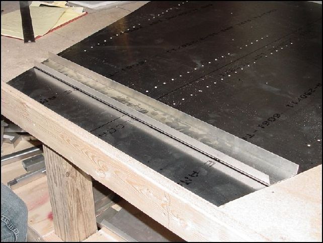 Measure from front of floor skin up 160mm.  This is the location of the BACK of the forward floor channel (20-F-17-4).  Position the floor channel to the skin and draw lines on the skin to mark it's position.