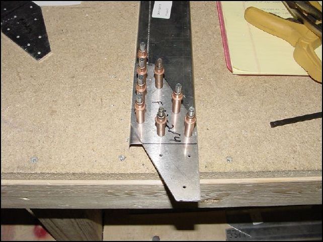 Drill through the brackets into the channel for AD-4 rivets.