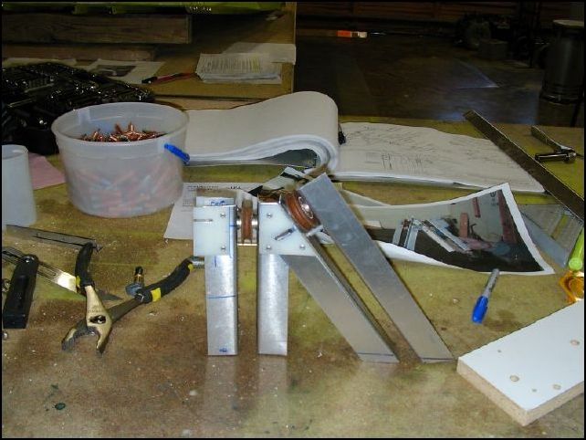 I did not make a step by step instruction for this since it really is very simple to make.  Just be sure to follow the drawings for the angles and distance between the center vertical L and the center angled L.