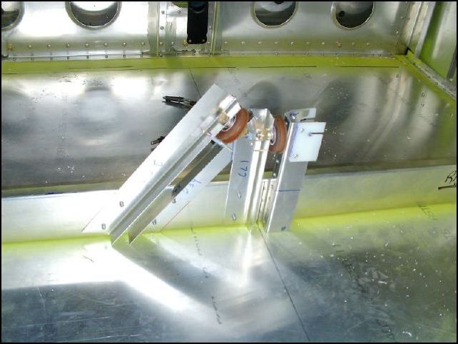 Install the HT pulley support assembly to the rear spar.  Be sure to line up the center pully with the center of the spar.