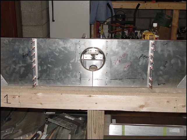 Cut two standard L's 250mm long.  Position L's to rear of front Z, drill and cleco in place A4 P35.  Make sure that you do not drill where the floor support will be located on the front of the front Z.  This was between the second and third rivet hole from the bottom on mine so I was able to drill all my holes.