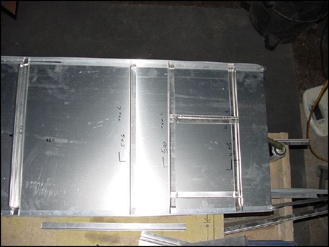 All Ls are .040 not standard Ls.  Cut Ls 496mm 500mm and 506mm.  These are your first three Ls.  Then cut two Ls 222mm, these are the horizontal Ls for the access door (left side skin only).  Jog the ends of the Ls and position the L's to the skin as per drawing.