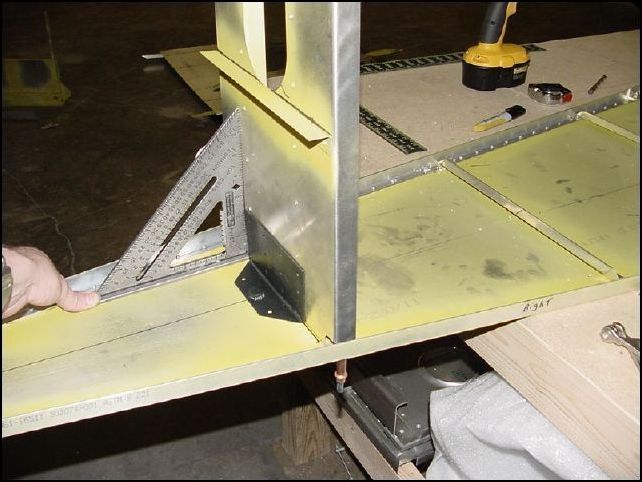 Square up the HT-frame and drill through the stiffener into the HT frame.  NOTE:  The HT fram is not actually square, the drawings show it as 88 degrees not 90, but I still used my square and found that it is very easy to lean it back the 2 degrees after drilling my rivet holes.
