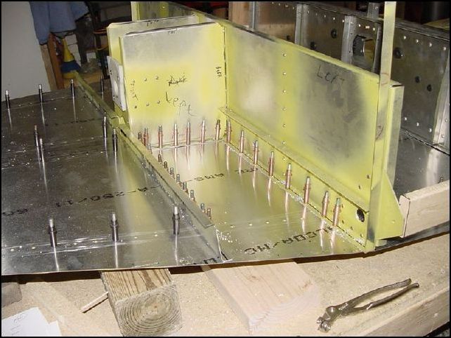 Drill and cleco the front spar to the front bottom skin.  Drawing 640-F-21 shows A4 P30.  NOTE:  I did not drill in any location that will have other parts crossing.