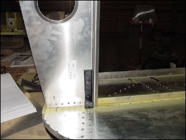 Rivet the two upper engine mount brackets to the horizontal panels.  Use AD 5 solid rivets, or AN3 bolts.