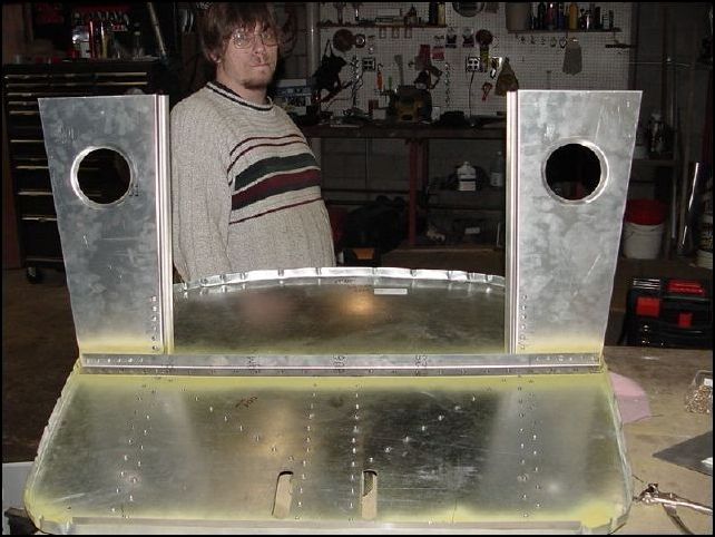 Completed horizontal panels rivited to firewall with upper engine mounts rivited in place.  The guy in this Picture is Rob Hansen