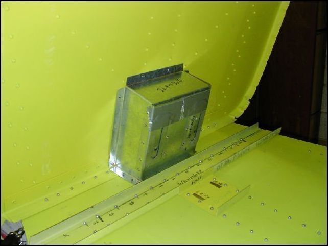 DO NOT DO THIS STEP YET!  I had to remove this part to install the nose gear because the bolts for the nose gear support are under this box.  ERRRG!  I will leave the instructions here so they can be used when it is time to install the steering box to the firewall.  Position the steering box to the rear of the firewall in the center against the cabin floor.  Drill and cleco in place.  Be SURE to use SS rivets.