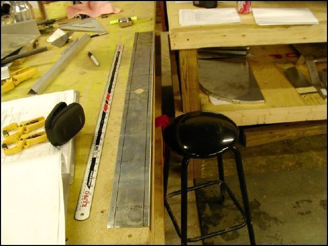 Measure 14 mm from the front of the seat panel and 12 mm from the rear and draw rivet lines.