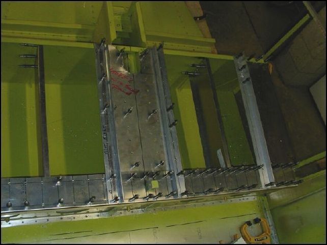 Drill and cleco.  Note that the outside seat rails can only be riveted with a few rivets at the front since they do not line up with the side seat channels all the way back to the center spar. 