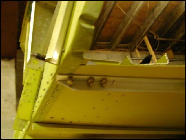 Line up the lower engine mount to the firewall and cabin floor.  Be sure to install the shim under the rear of the lower engine mount bracket.  Clamp in place and drill holes for three bolts.  Be sure that these holes are in the center of the longerons.