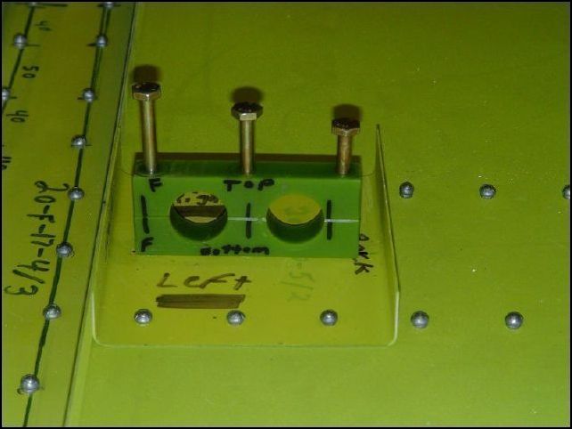 Position 20-C-6-2 (pedal center bearing) into 640-F-17-5 and center with the floor.  Drill the three bolt holes.  When drilling the bearing, make sure that the two holes for the rudder pedals are nice and round and with the proper hole size.