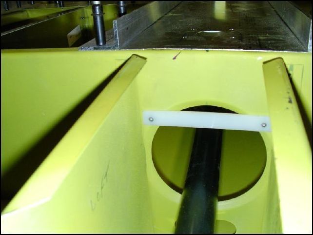 This should have been done when I assembled the Front Z and torque tube tunnel sub-assembly.  However I did not have this part at that time so I'm doing it now.  Install 20-C-10-2 (fairlead) to the front part of the front Z, parallel and centered, down 70mm from the top of the Z.