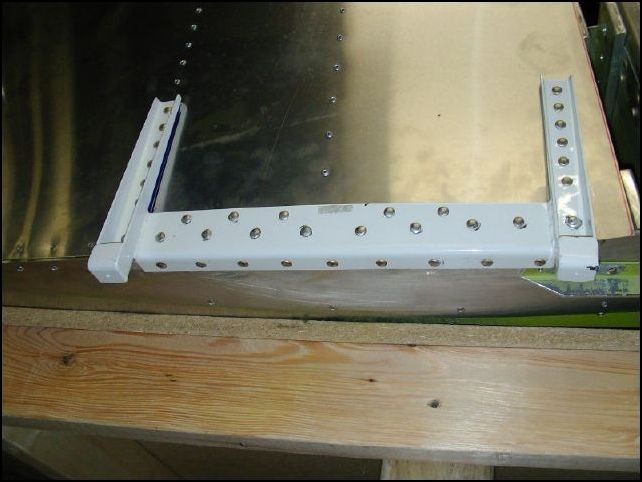 Install left and right main gear supports.  MAKE SURE the main gear support is clamped tightly in all directions when drilling.  Aslo be sure to put the spacer under the front.  This was not as hard as I expected it to be.  If you drill and clamp as you go from the back toward the front then the support will bend around the fuselage for a nice tight fit.  All rivets are AD5 but range in how long they are.