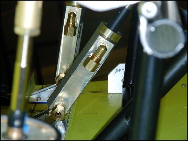 Install brake line fittings to cylinders.  This image shows the fittings for the slave cylinders on the co-pilots side.