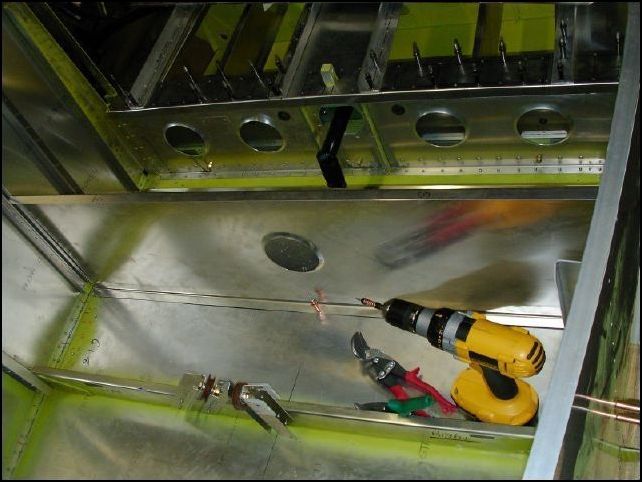 Install the rear seat front support (640-F-40-1) to the fuselage floor flush to the side skins and against the front of the main gear upright (640-25-1).  Cut out the top ends of this part to clear the uprights.