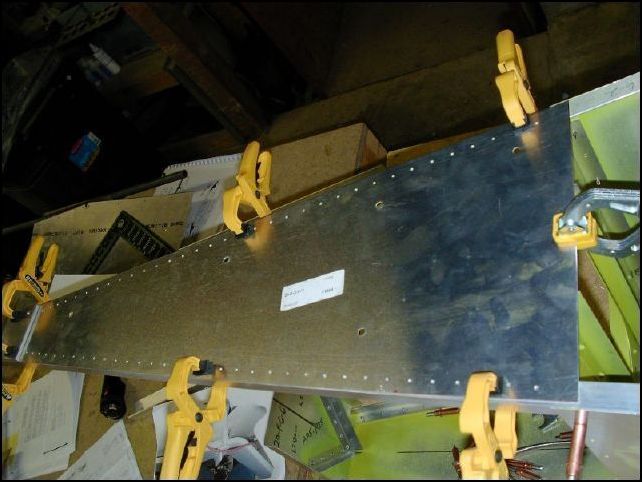 Position the rear upper skin to the top of the longerons and even with the forward edge of the HT panel.