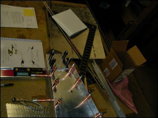 Drill and cleco the upper rudder hinge at this time.  This part will be bolted with AN3 bolts later.