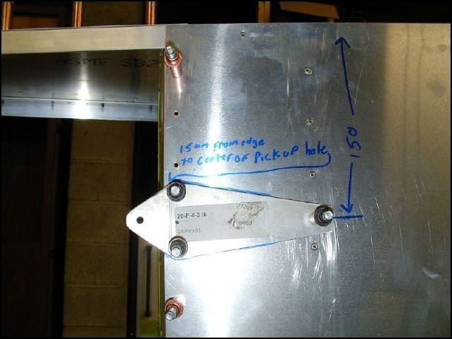 Position, drill, and cleco the left and right horizontal tail attachments.  Cleco from the inside of the fuselage.  This part is 150 mm from the top of the longeron to it's center line and is also 15 mm from the rear of the HT panel to the center of the rear bolt hole.