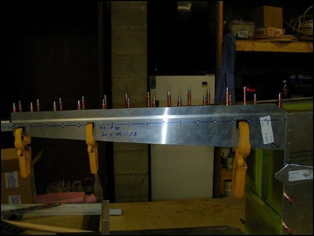 Position the upper rear side skins to the fuselage.  The bend in the skin is above the top longerons and the front of the skin is flush with the front of the HT frame.